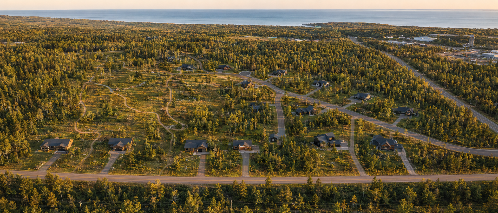 Aerial view of the wooded Whispering Pines land